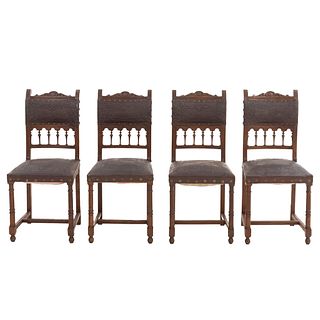 Lot of 4 chairs. France. 20th Century. Henri II. Carved in oak. Semi-open backrests and seats in faux leather.