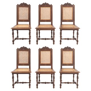 Lot of 6 chairs. France. 20th Century. Henri II. Carved in oak. Backrests and seats in bejuco.
