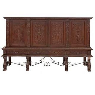 Buffet or Sideboard. France. 20th Century. Spanish Style. Carved in oak. 4 hinged doors and 4 drawers. 58 x 98.4 x 23" (148 x 250 x 59 cm)