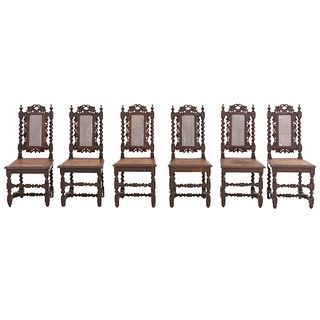 Lote de 6 sillas. France. 20th Century. Carved in oak. Semi-open backrests and seats in bejuco.