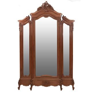 Wardrobe. France. 20th Century. Louis XV. Carved in walnut. With drawer, 3 doors with mirrors. 102.7 x 62.9 x 18.5" (261 x 160 x 47 cm)