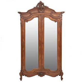 Wardrobe. France. 20th Century. Louis XV. Carved in walnut. 2 doors with mirrors. 98.4 x 57 x 20.4" (250 x 145 x 52 cm)