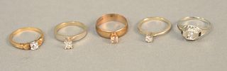 Five diamond rings to include one 18K gold and four 14K gold, each set with small diamonds. total weight 24.4 grams.