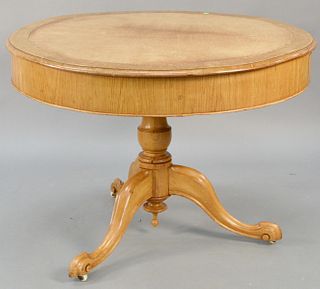 Drum table with leather top. ht. 29 1/2 in., dia. 42 in. Provenance: Former home of Mel Gibson, Old Mill Rd, Greenwich, CT