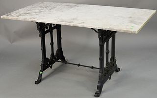 Iron base table with rectangle marble top. ht. 28 in., top: 29" x 54".Provenance: Former home of Mel Gibson, Old Mill Rd, Greenwich, CT