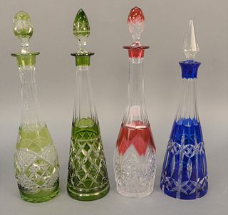 Group of four cut to clear glass decanters, two green, one ruby, and one blue. tallest ht. 16 1/4 in. Provenance: The Estate of Ed Brenner, Short Hill