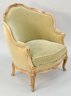 Louis XV style bergere. ht. 39 1/2 in., wd. 34 in. Provenance: Former home of Mel Gibson, Old Mill Rd, Greenwich, CT