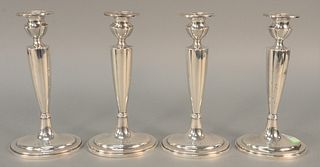 Set of four Gorham sterling silver candlesticks, weighted. ht. 9 in.