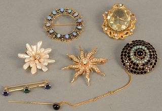 Six 14K gold brooches, one with large oval citrine and small diamond, and one starfish with diamonds and pearls.