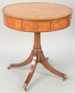 Custom mahogany drum table with leather top, four drawers and revolving top. ht. 29 in., dia. 28 in. Provenance: Estate of William and Teresa Patton, 