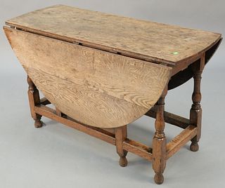 Jacobean oak gate leg drop leaf table with drawers (restored). ht. 28 1/2 in., top open: 49" x 55". Provenance: Former home of Mel Gibson, Old Mill Rd