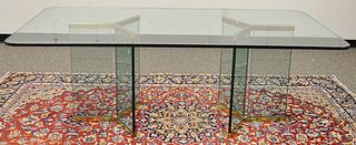 Glass top table on double brass trimmed glass bases. ht. 29 in., top: 42" x 80". Provenance: Estate of William and Teresa Patton, Lake Ave Greenwich, 