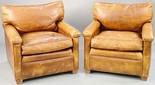 Pair of brown leather easy chairs. ht. 30 1/2 in., wd. 32 in. dp. 37 in. Provenance: Former home of Mel Gibson, Old Mill Rd, Greenwich, CT