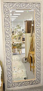 Large rectangle beveled glass mirror with carved frame. 79" x 36" Provenance: The Estate of Ed Brenner, Short Hills N.J.