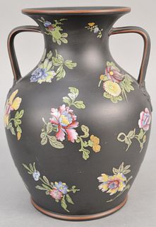 Large Wedgwood black basalt urn/vase, having two handles and enameled blossoming flowers, impressed Wedgwood mark on bottom. ht. 10 in. Provenance: Th