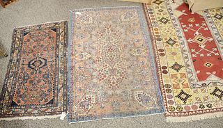Four oriental throw rugs. 2' 3" x 3' 10", 3' x 4' 10", 3' 11" x 6' 11", 3' x 5'.