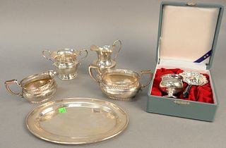 Sterling silver group to include two pairs of sugars and creamers, one with under plate along with a tea strainer in fitted box. 25 t.oz. plus weighte