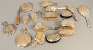 Group of sterling silver vanity brushes and mirrors all weighted.