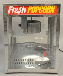Commercial grade stainless steel popcorn machine, Pop-N-Serve, server product, 14 or 16 oz. ht. 26 1/2 in., wd. 20 in. Provenance: Former home of Mel 