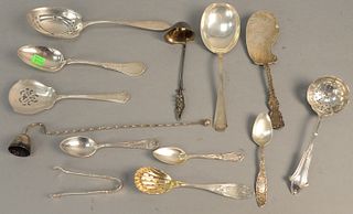 Group of sterling silver serving pieces to include spoon, ladles, strainers, etc. 22.6 t.oz.