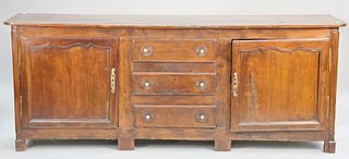 Primitive Jacobean style server having three drawers, flanked by two doors. ht. 36 in., top: 21" x 91". Provenance: Former home of Mel Gibson, Old Mil