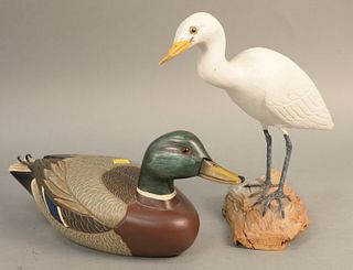 Two piece lot to include carved Egret decoy signed on bottom and a carved male mallard by Charles Moore. Egret ht. 11 1/4 in., mallard ht. 6 in. Prove