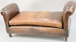 Brown leather daybed (arms drop) (one seam split in cushions 6"). closed lg. 63 in. Provenance: Former home of Mel Gibson, Old Mill Rd, Greenwich, CT