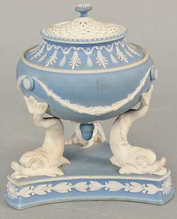 Wedgwood pale blue Jasper tripod urn with pierced cover, supported on dolphin legs, classical motifs throughout, Wedgwood stamp on bottom, wear consis