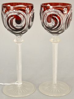 Pair of ruby cut to clear stem glasses with air twist stems. ht. 7 1/2 in. Provenance: The Estate of Ed Brenner, Short Hills N.J.