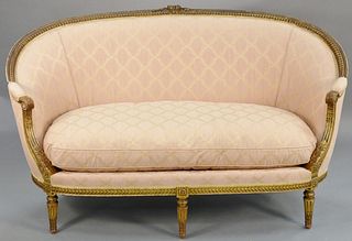 Louis XIV style canape, with custom silk upholstery (traces of gilt) (one stain). ht. 37 in., wd. 65 1/2 in. Provenance: Former home of Mel Gibson, Ol