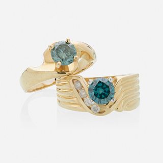 Irradiated blue diamond and yellow gold rings