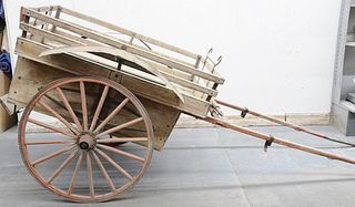 Horse drawn wood cart with seating and door, metal fenders. cart lg. 58 in., wd 44 in. plus fenders and shaft. Provenance: Former home of Mel Gibson, 