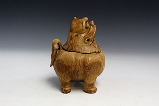 Chinese carved bone incense burner of a foo dog.