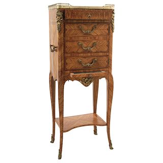 Cabinet. France. 20th Century. Carved oak with golden metal applications. Four drawers.