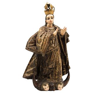 Virgin of the Immaculate Conception. Mexico. 19th Century. Carved gold, punched wood.
