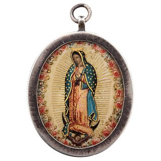 Reliquary with Virgin of Guadalupe. Mexico. 19th Century. Polychromed ivory and gold sheet. Silver frame. 2.5" (6.5 cm.)