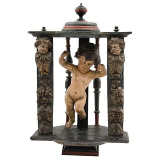 Niche. Mexico. 19th Century. Carved, polychromed wood. Figure of baby Jesus in burnished wood. Decorated with vegetable motif.