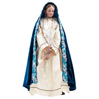 Virgin Mary. Mexico. Early 19th Century. Flesh-colored wood with removable head and limbs. Includes garments.