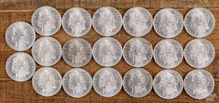 Twenty Morgan silver dollars, 1884 O, uncirculated.