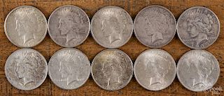 Ten silver Peace dollars, 1922-1925, various grades.