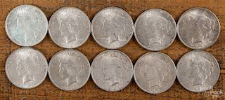 Ten silver Peace dollars, 1922-1925, various grades.