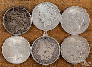 Five silver Peace dollars, to include one 1922, three 1923, and one 1924