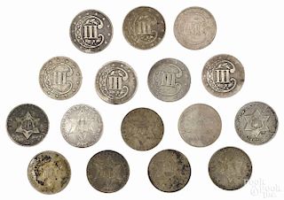 Sixteen silver three cent coins, to include two 1852, G, three 1853, G, an 1854, VG-F, an 1856, VG,
