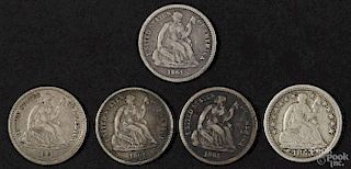 Five half dimes, to include an 1853 with arrows, F, and four 1861, VG-F.