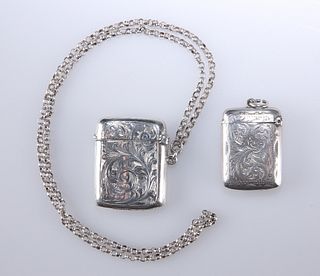 TWO EDWARDIAN SILVER VESTA CASES, the first Birmingham 1907 with foliate sc
