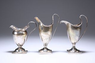 THREE SILVER CREAM JUGS, the first, London 1913; the second, Mappin & Webb,