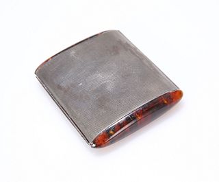 AN ART DECO SILVER AND TORTOISESHELL COMPACT, of navette section with round