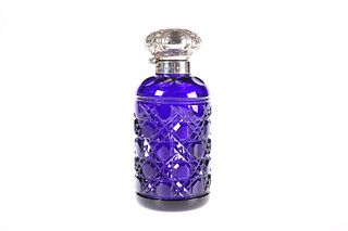 A SILVER-TOPPED BLUE-GLASS SCENT BOTTLE, BIRMINGHAM 2001, in Victorian styl
