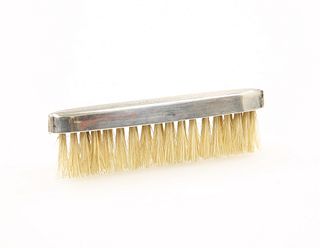A STERLING SILVER MOUNTED MOUSTACHE BRUSH, with engine turned decoration. 8