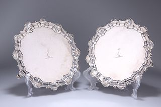 A MATCHED PAIR OF GEORGIAN SILVER WAITERS, LONDON 1752 AND 1770, each circu